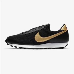 black nike with gold swoosh womens